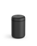 Fellow Atmos Vacuum Canister in matte black with a round lid and small top button.