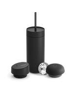 Fellow Carter 3-in-1 Lid System mug in matte black with straw, lid, and two round accessories.