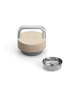 Fellow The Carry Lid in beige and silver with handle, shown beside stainless steel base insert.