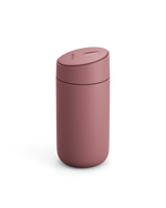 The Fellow Carter Slide Mug, a pink reusable travel cup with a rounded lid, on white background.