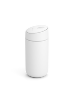 The Fellow Carter Slide Mug is a minimalist white cylinder with a rounded, slightly tilted lid.