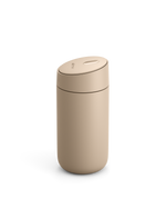 Fellow Carter Slide Mug, beige, with rounded lid on a white background.