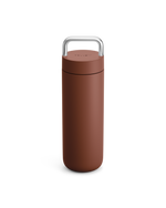 The Fellow Carter Carry Travel Mug in Sienna, shown with silver handle, on a white background.