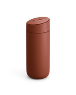 The Fellow Carter Slide Mug is a matte brown travel mug with a seamless, rounded design and lid.