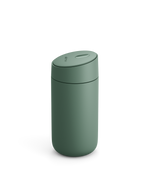 Fellow Carter Slide Mug in matte green with oval lid shown on white background.
