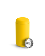 Fellow Carter Move Mug in Lemon Zest with metal tea infuser lid on a plain white background.