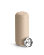 Beige Fellow Carter Move Mug with removable metal strainer on a white background.