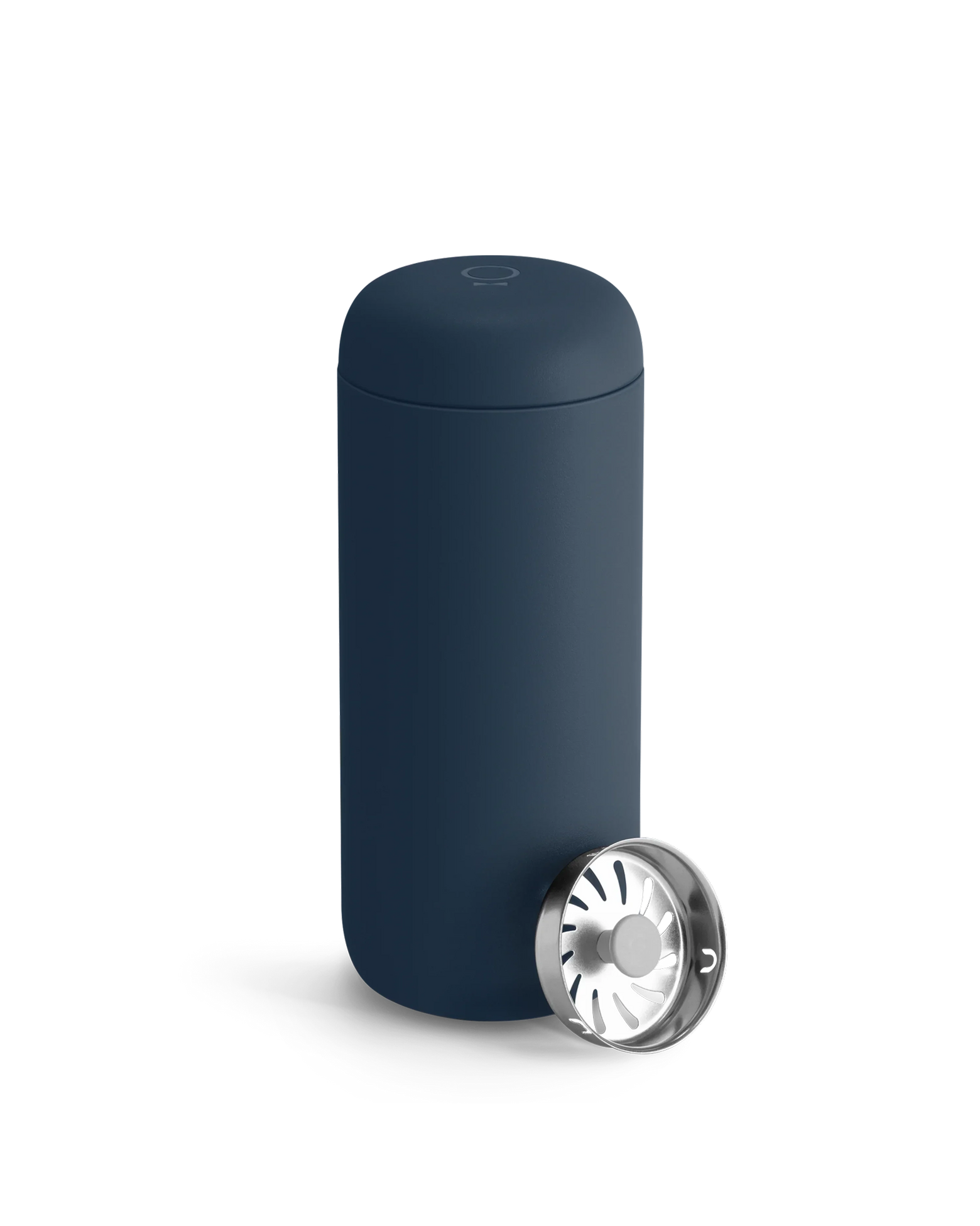 A Fellow Carter Move Mug in navy blue with its lid off and set next to it.
