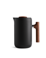 Fellow Clara French Press, matte black with mesh filter and wooden handle on white background.