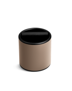 The Fellow Espresso Knock Box in Malted Chocolate has a swing lid and silicone-wrapped knock bar.